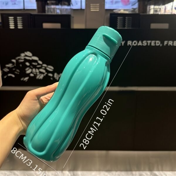 82762e2c-8d28-11f0-bd42-0a580ab054f5.jpg Premium Cola-Shaped Narrow-Mouth Travel Bottle